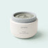 A white cosmetic jar of SEORA Triple Clay Pore Mask with a gray lid, showing the gray mask inside, set against a clean light gray background.
